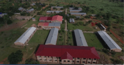 Aerial view of campus showing the Legacy Building, four class blocks, science lab, cafeteria, hostels and teacher houses.
